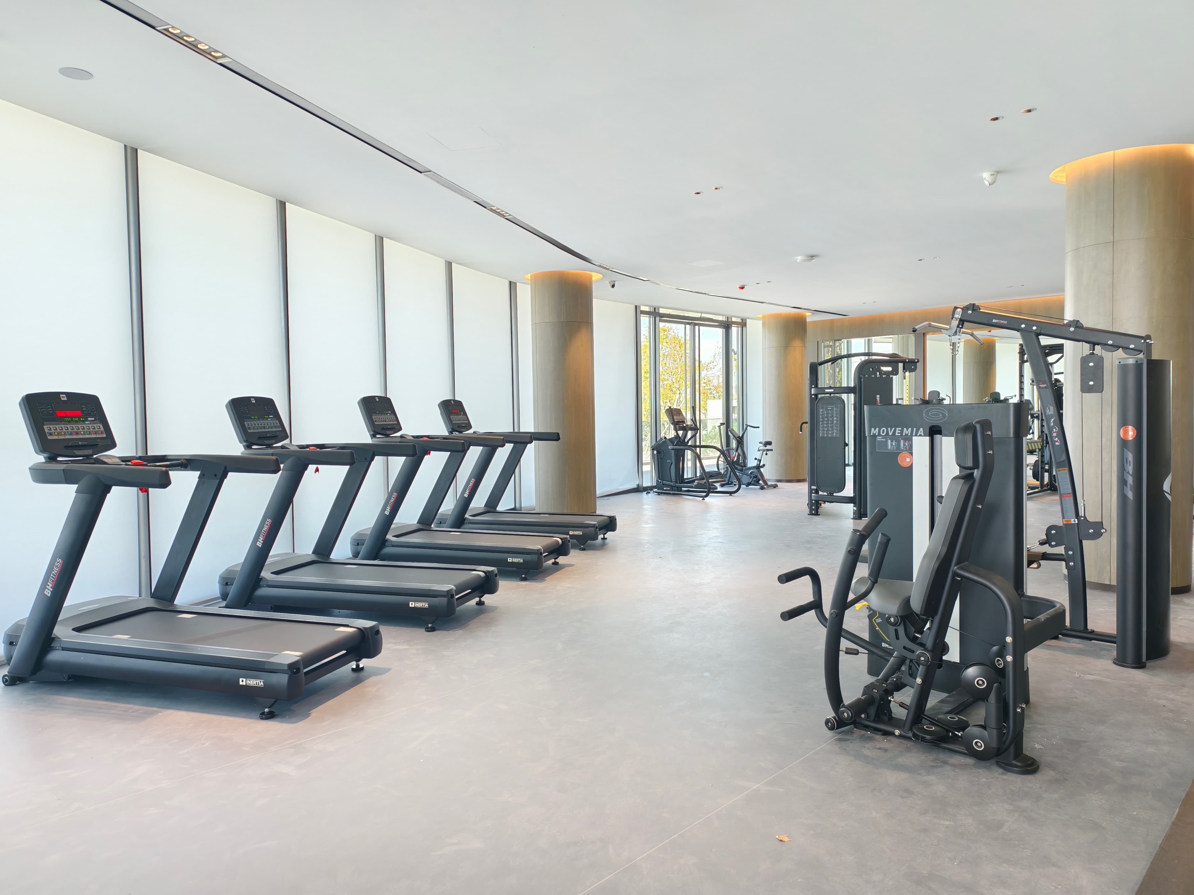 Commercial gym installation with BH Fitness Inertia treadmills and Movemia strength station